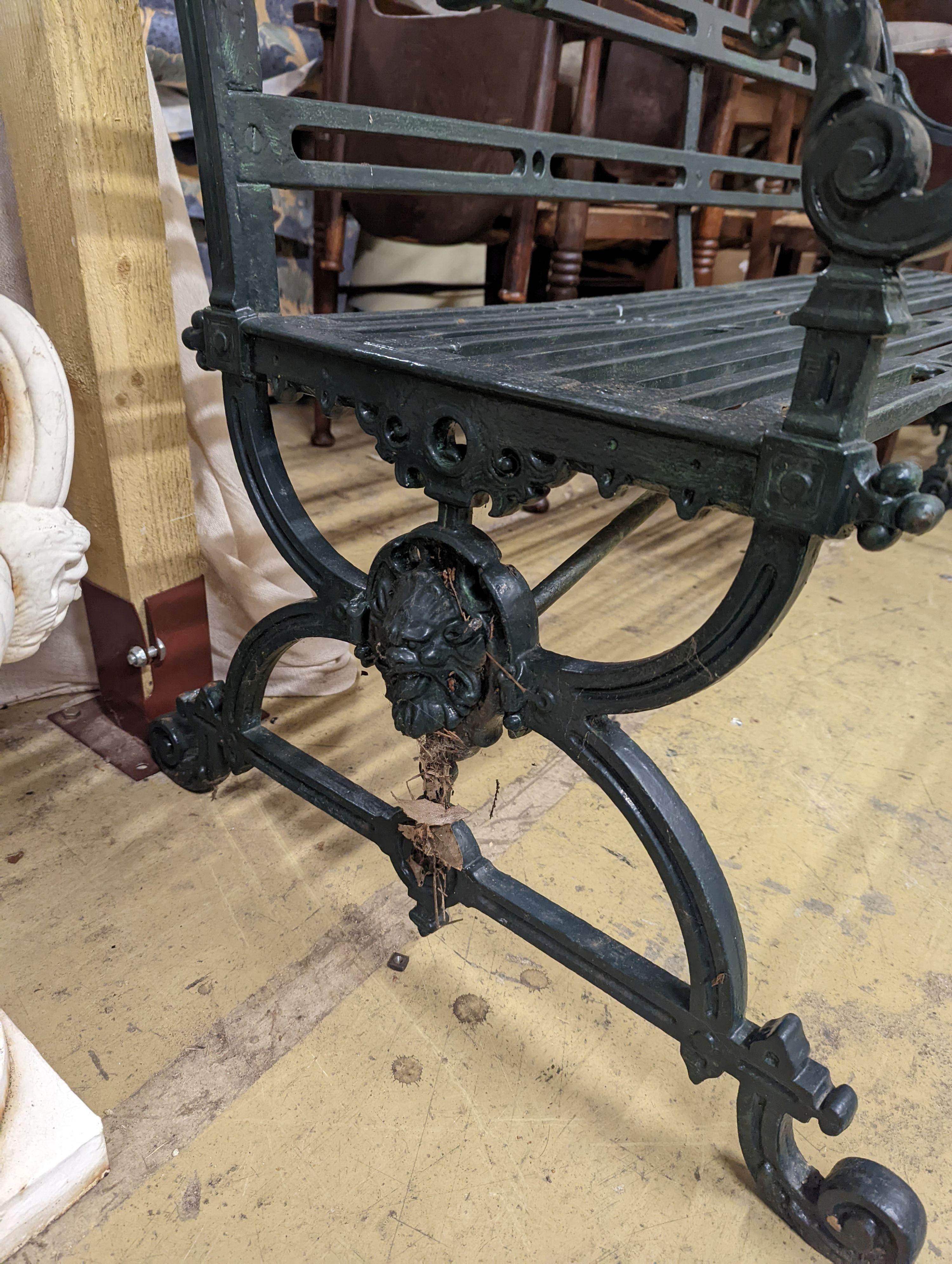 A Victorian style Coalbrookdale design green painted cast iron garden bench, length 123cm, depth 45cm, height 80cm